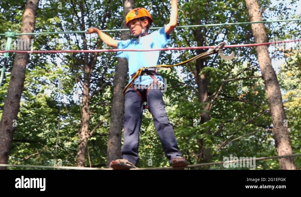 Boy tree climbing helmet Stock Videos & Footage HD and 4K Video Clips