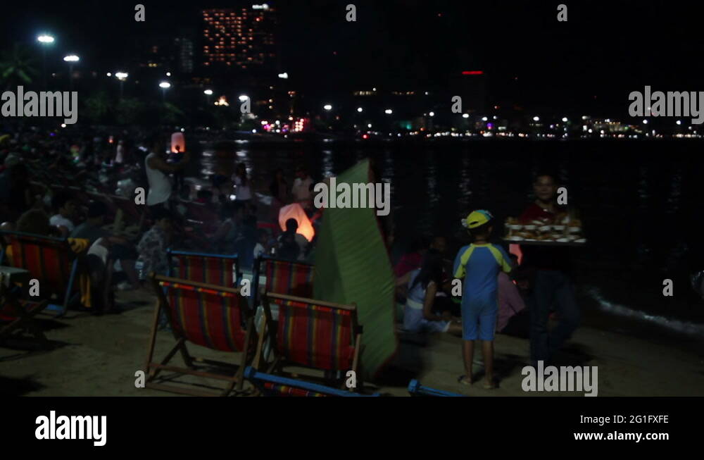 People are releasing hot air chinese sky lanterns Stock Video Footage