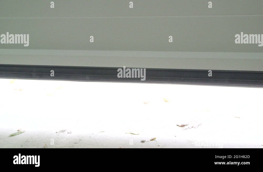 Sectional automatic garage door opening Stock Video Footage Alamy