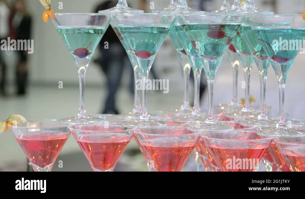Pyramid of red blue champagne martini glasses at event Stock Video Footage Alamy