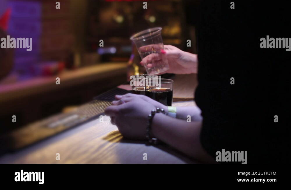 mixing whiskey with coke at Stock Video Footage Alamy