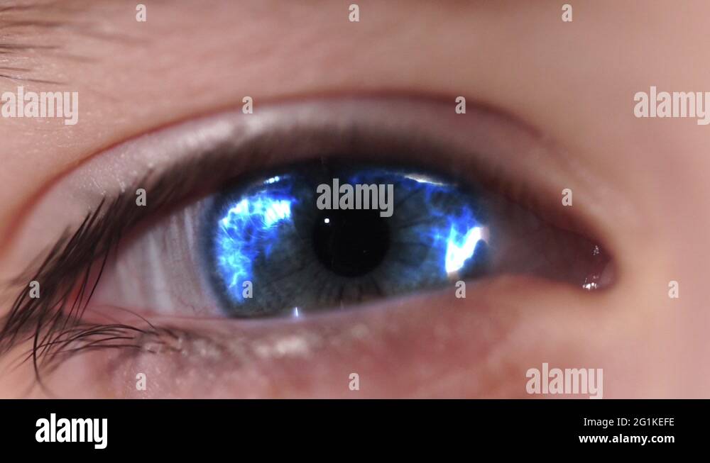 Electric Lightnings in Eye. An Eye Blinks and Changes Color to the Blue
