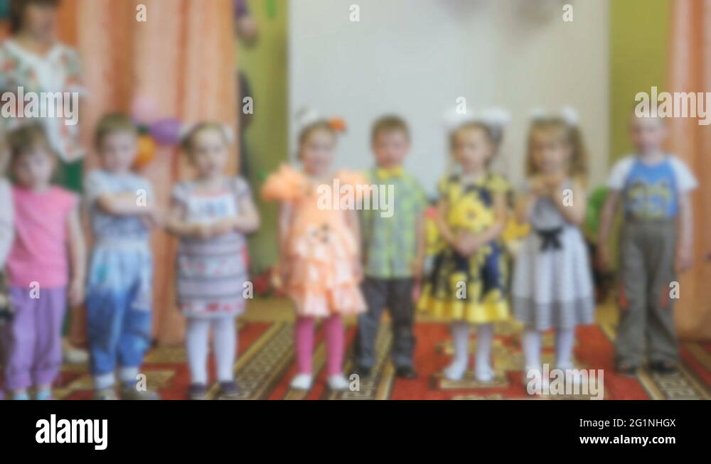 Little children stand and clap in the auditorium Stock Video Footage