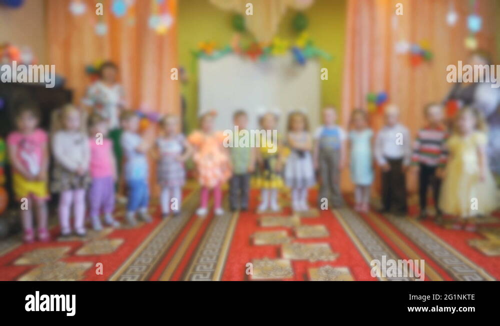 Little children stand and clap in the auditorium Stock Video Footage