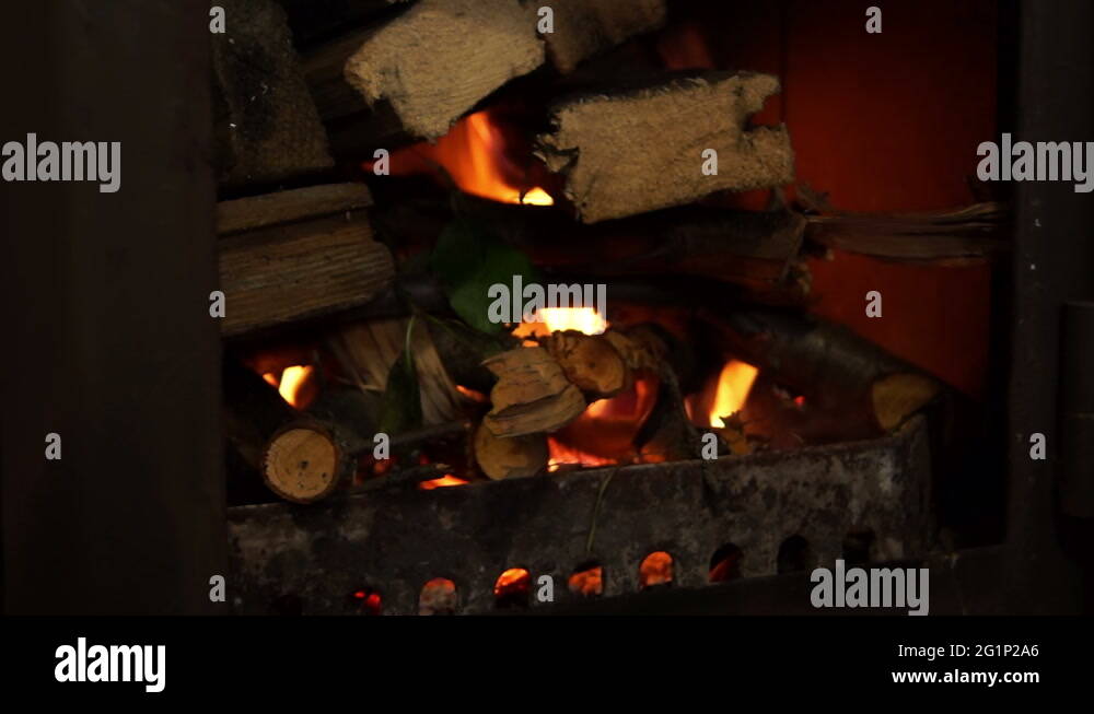 The process of blurring the wood in the fireplace erupted in the metal Stock Video Footage Alamy