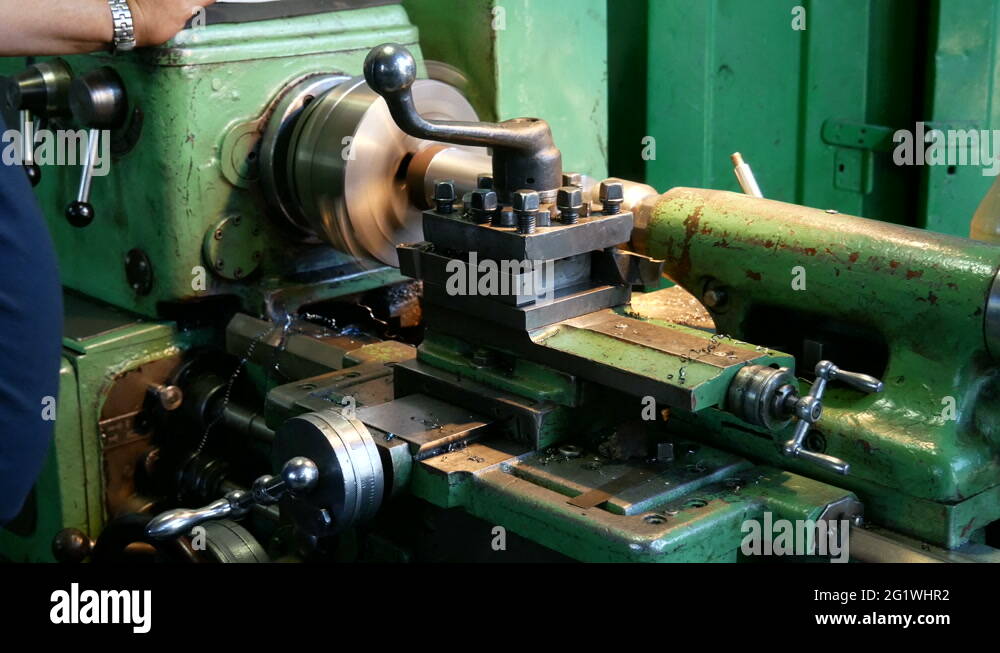 Turning lathe in action.Facing operation of a metal blank on turning