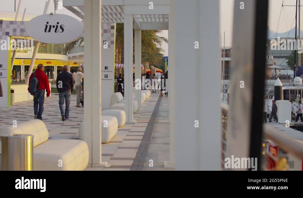 People walking near Iris Bar in Abu Dhabi Stock Video Footage Alamy