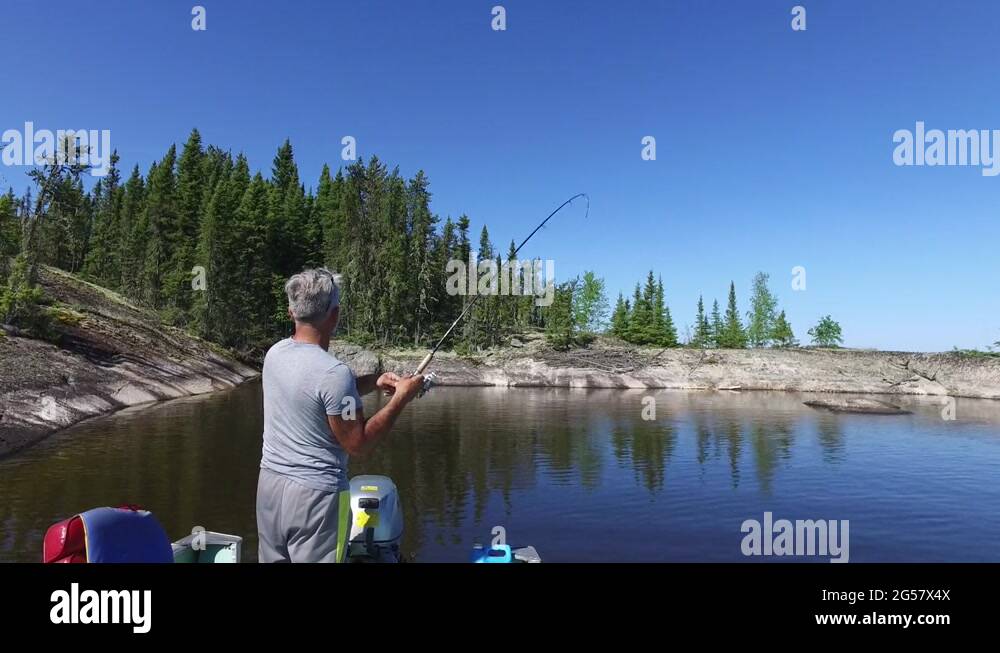 Man catching fish Stock Videos & Footage HD and 4K Video Clips Alamy