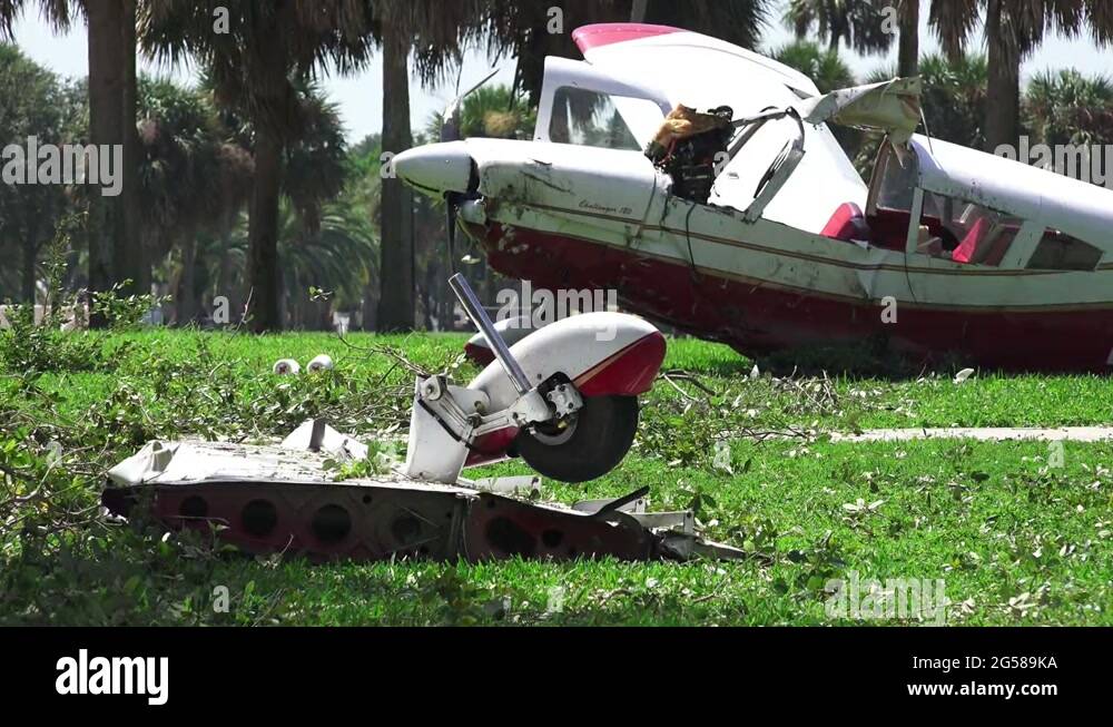 Airplane's Broken Wing / Landing Gear Fuselage In Background Crash