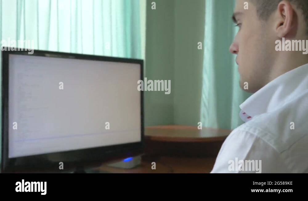 Young computer programmer coding at his desk Stock Video Footage - Alamy