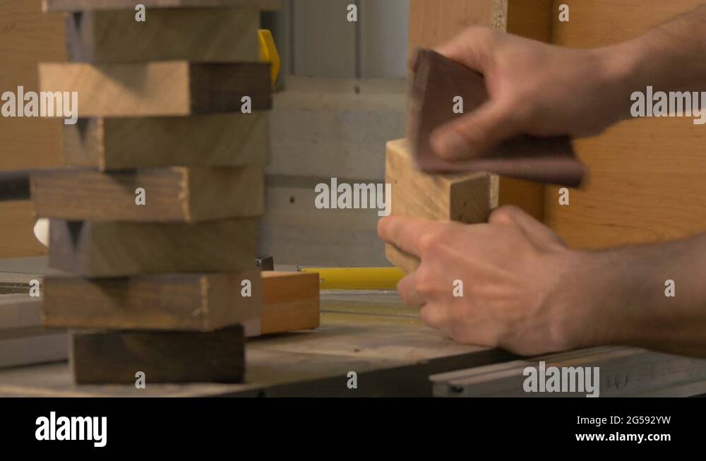 Dusting a piece of wood Stock Video Footage Alamy