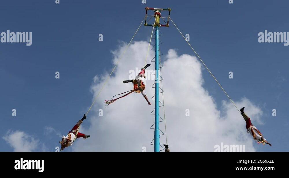Tulum Mexico acrobat men high rope swing dangerous DCI 4K Stock Video