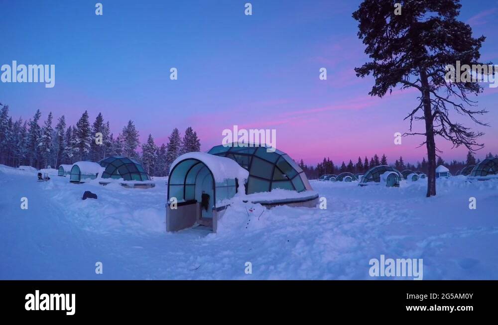 Sunset above amazing glass igloo village at Kakslauttanen Arctic Resort Finland Stock Video