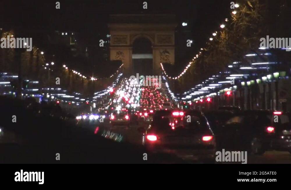 Timelapse of The Arc de Triomphe in Paris night car street traffic