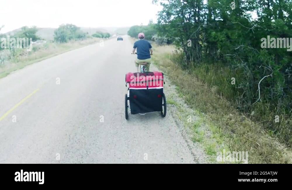 Mother Pulling Bike Trailer Stock Video Footage Alamy mother-pulling-bike-trailer-stock-video-footage-alamy