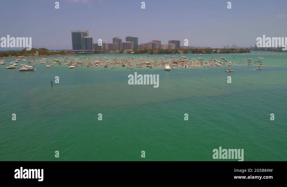 Boats and kayaks at Haulover sand bar Memorial Day weekend Stock Video