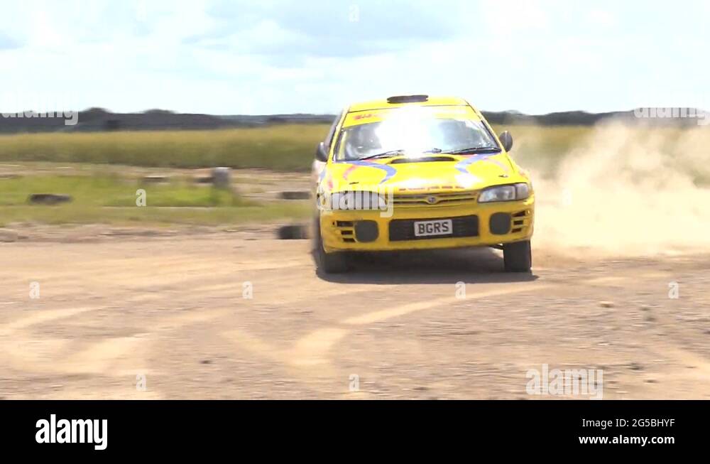 Rally car cornering - Subaru Impreza, lots of dust - from outside the ...