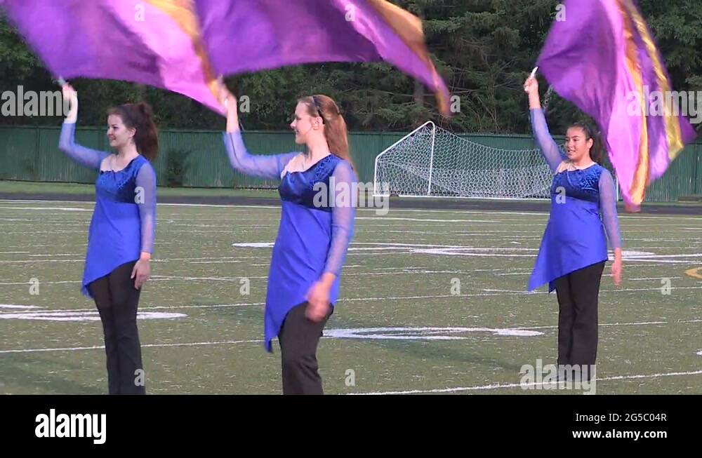Marching bands drums corps and crowds on university college football field Stock Video Footage