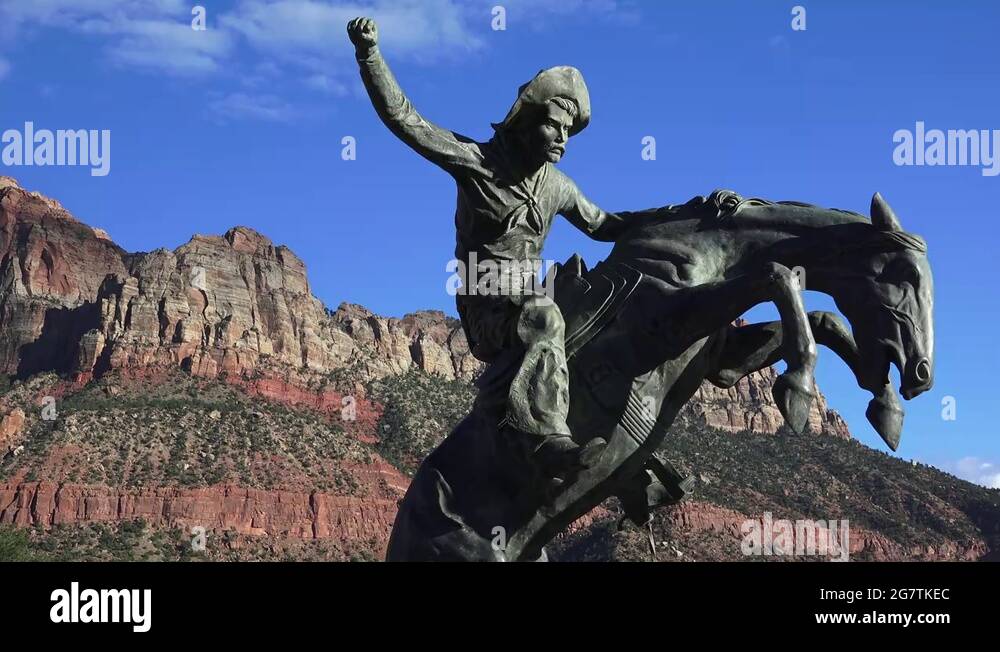 zoom in ,Bronze statue of cowboy on rearing horse, sept 2016 Stock