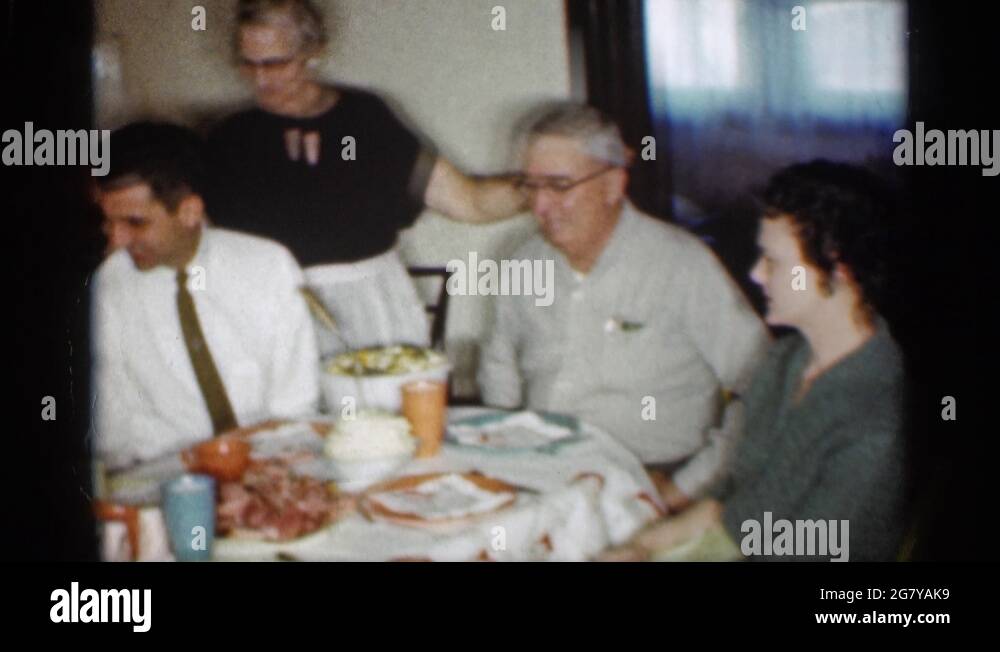 INDIANA-1959: Older Woman Wearing Black Dress With White Pron Putting