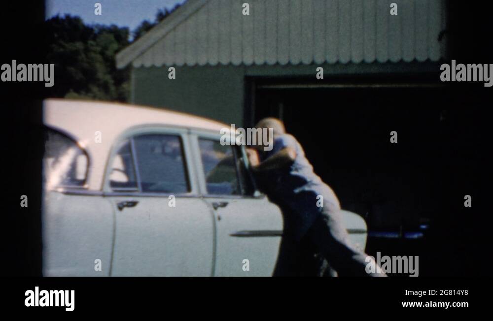 CATSKILL NEW YORK1957 Man Does Preventive Maintenance Of His Car