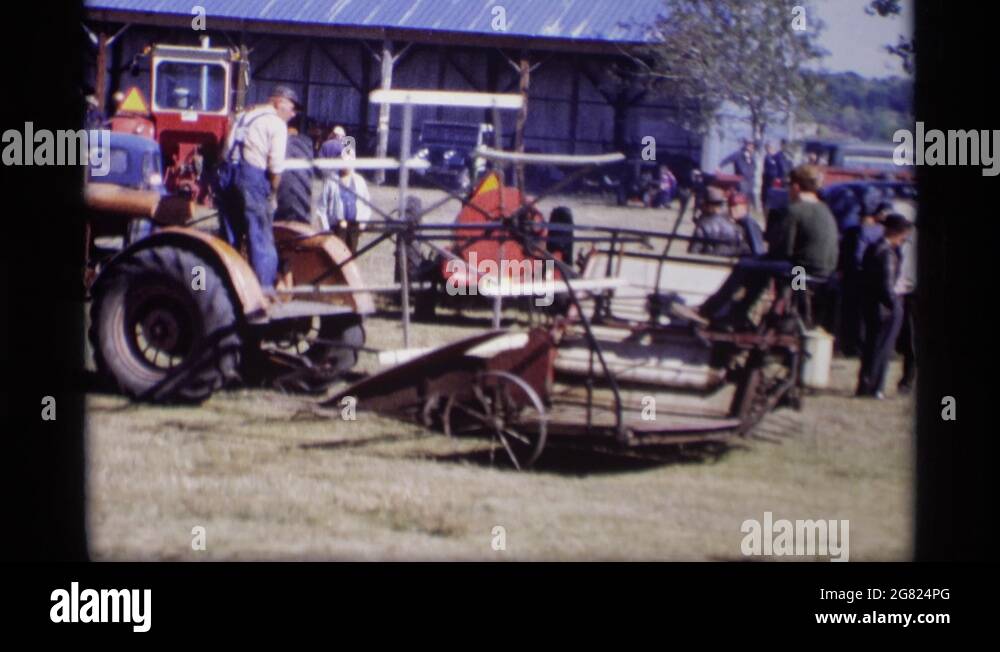 JORDAN MINNESOTA1969 A Very Old Red Car A Tractor And A Grove Stock