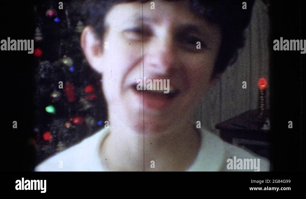 ATHENS OHIO USA1966 Children Playing With Dolls In Front Of Christmas Tree Stock Video Footage