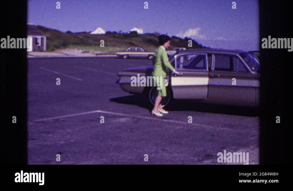 ROCKAWAY BEACH NEW YORK USA1967 Woman Opened Car Door In Parking Lot