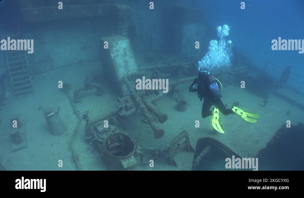 scuba diver underwater exploring the shipwreck underwater ship wreck ...