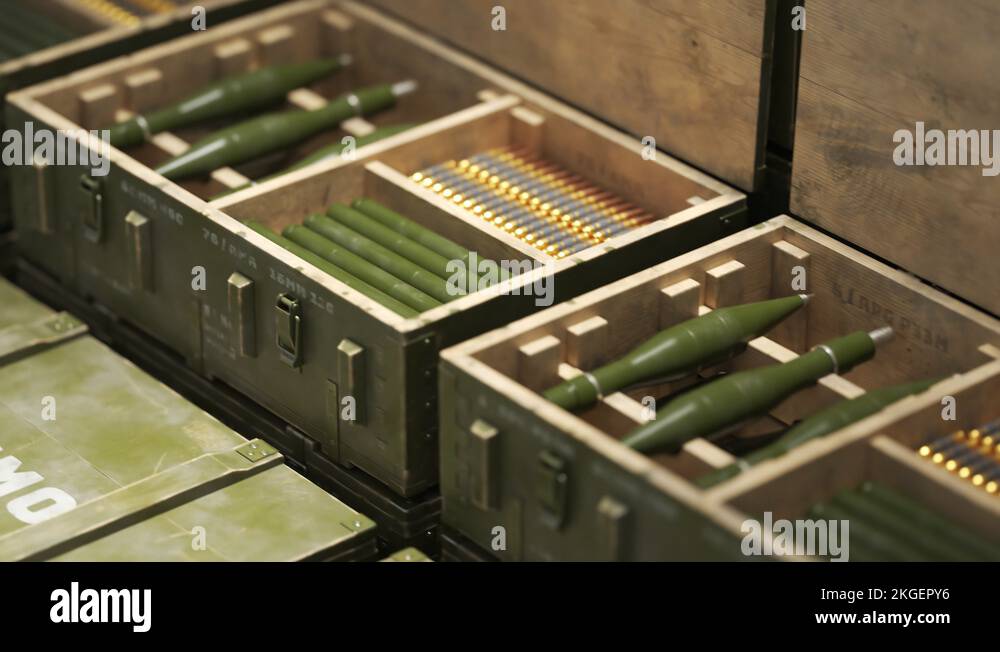 Opened military box with RPG projectiles and rifle ammunition. Endless ...