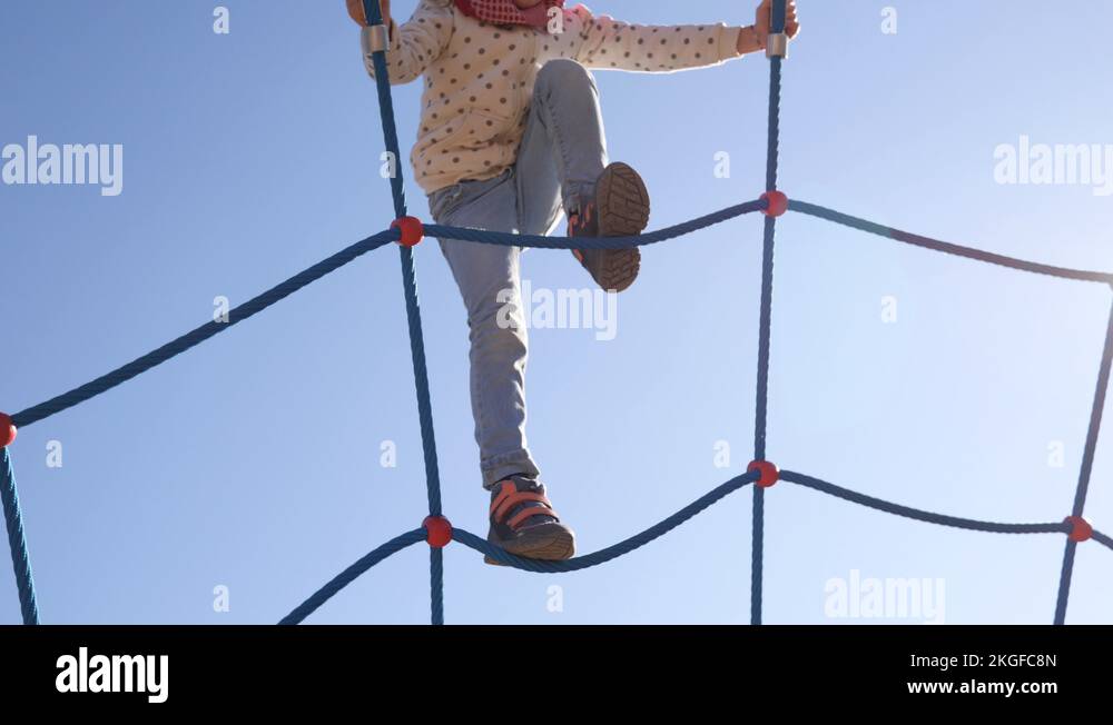 24 Rope web climbing and crawling little child girl on outdoors ...
