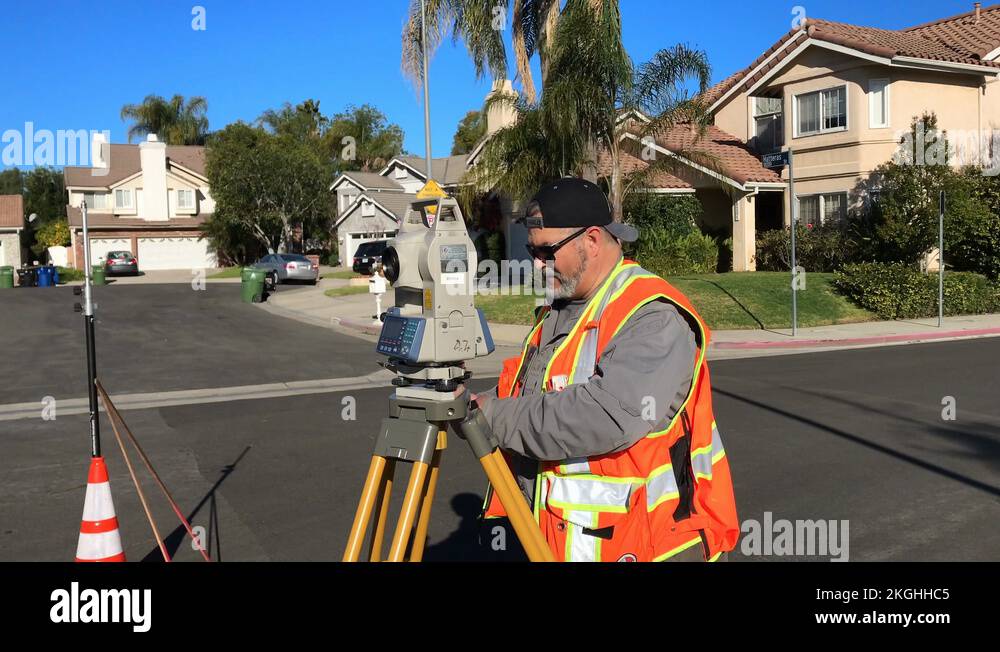 Land Surveyor construction worker with theodolite level tool in Los