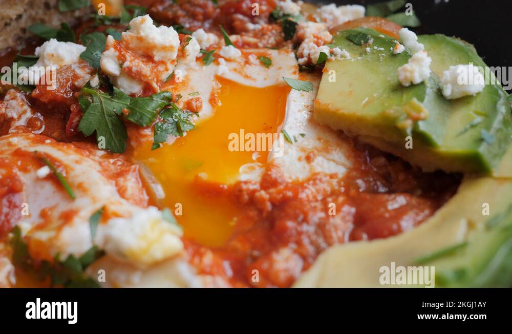 Man eating in cafe bar a tasty mishmash food for breakfast with full