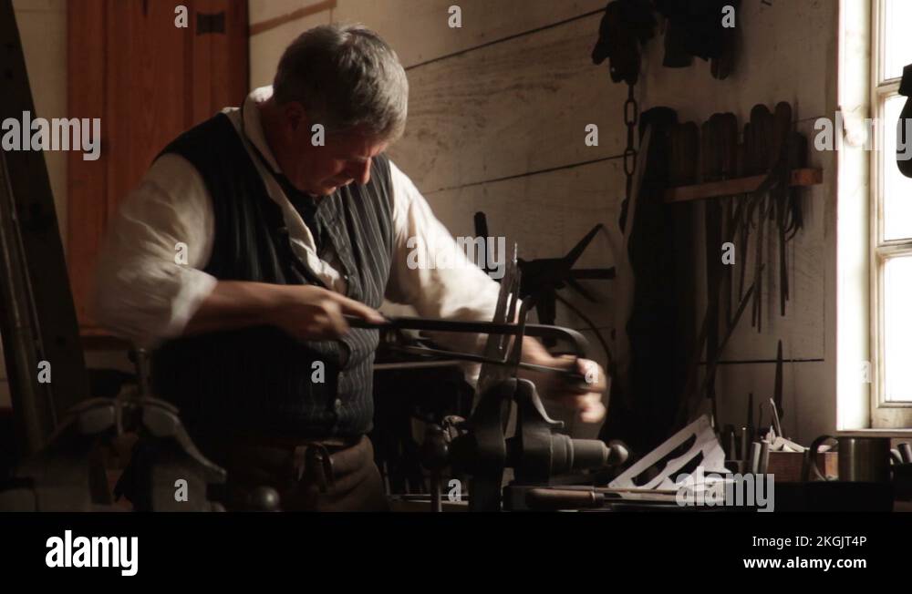 Colonial Blacksmiths Working as a Gunsmith with metal tools