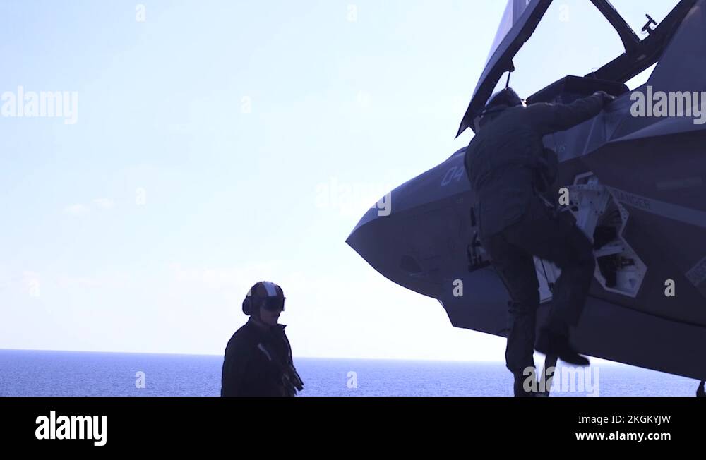 Pilot descending cockpit ladder of F35B Lightning II aboard USS Wasp