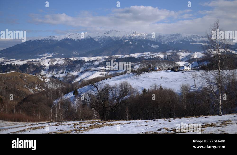 8K Time Lapse of Moieciu Village Snow Capped Bucegi Mountains