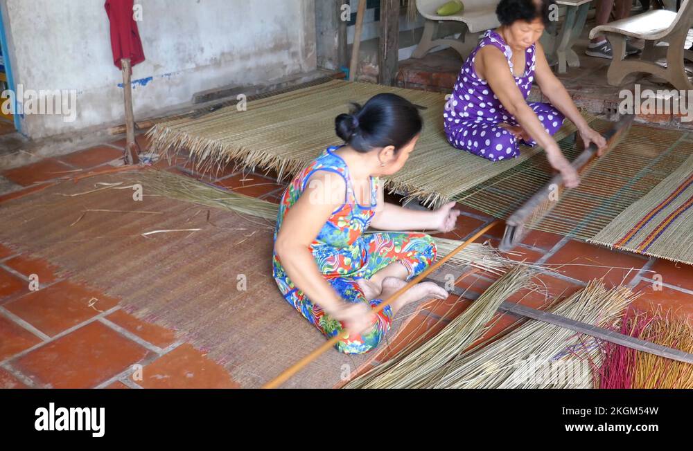 Women in village making reed mats Stock Video Footage Alamy