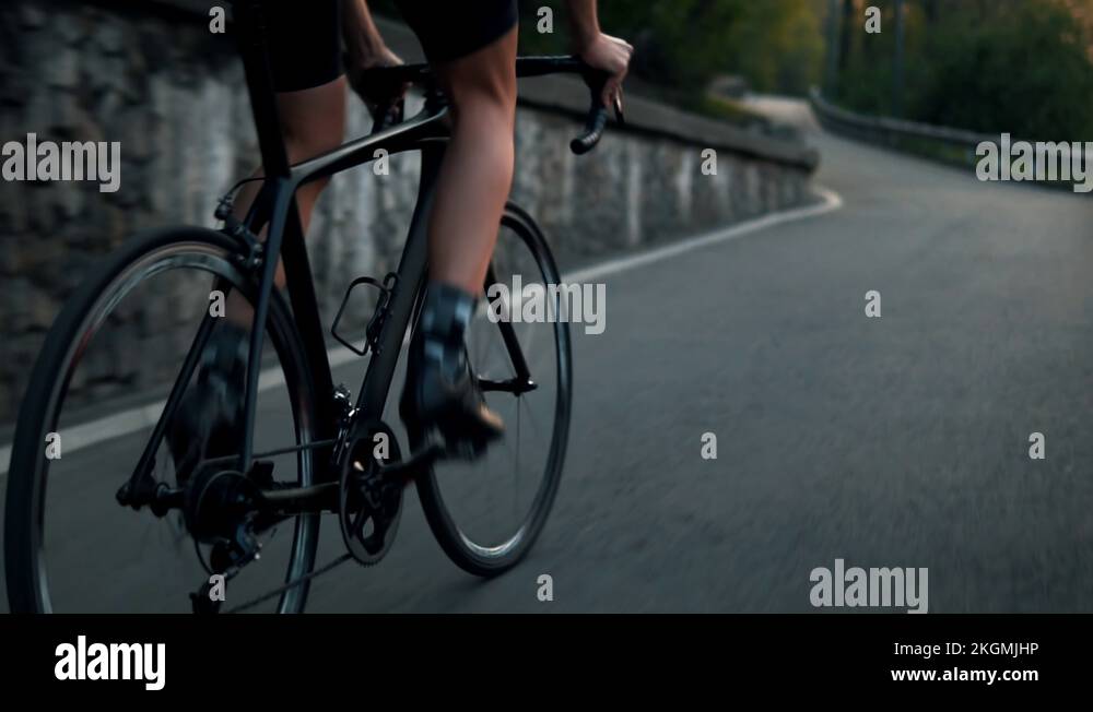 Close Up Legs Of Road Cyclist Riding Bicycle Slow Motion.Cyclist Legs
