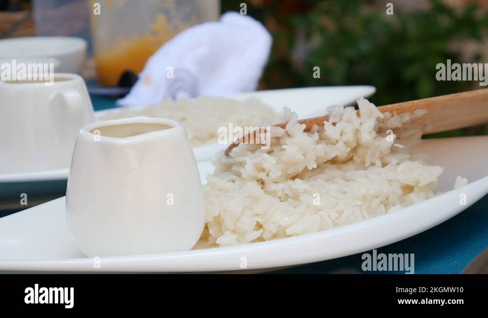 Sticky Rice 4k Woman lay Thai sticky rice on a plate before serving. Thai cuisine ...