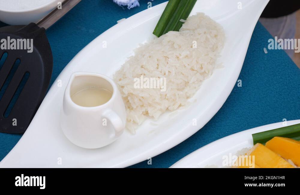 Sticky Rice 4k Woman lay Thai sticky rice on a plate before serving. Thai cuisine ...