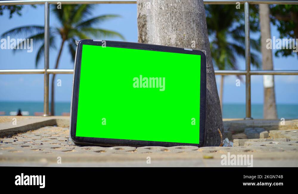 TV stands on the beach. Television with Green Screen. You can replace