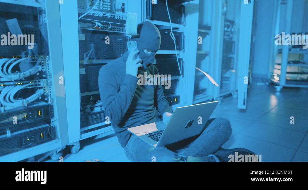 hacker hiding from crime scene in data centre Stock Video Footage Alamy
