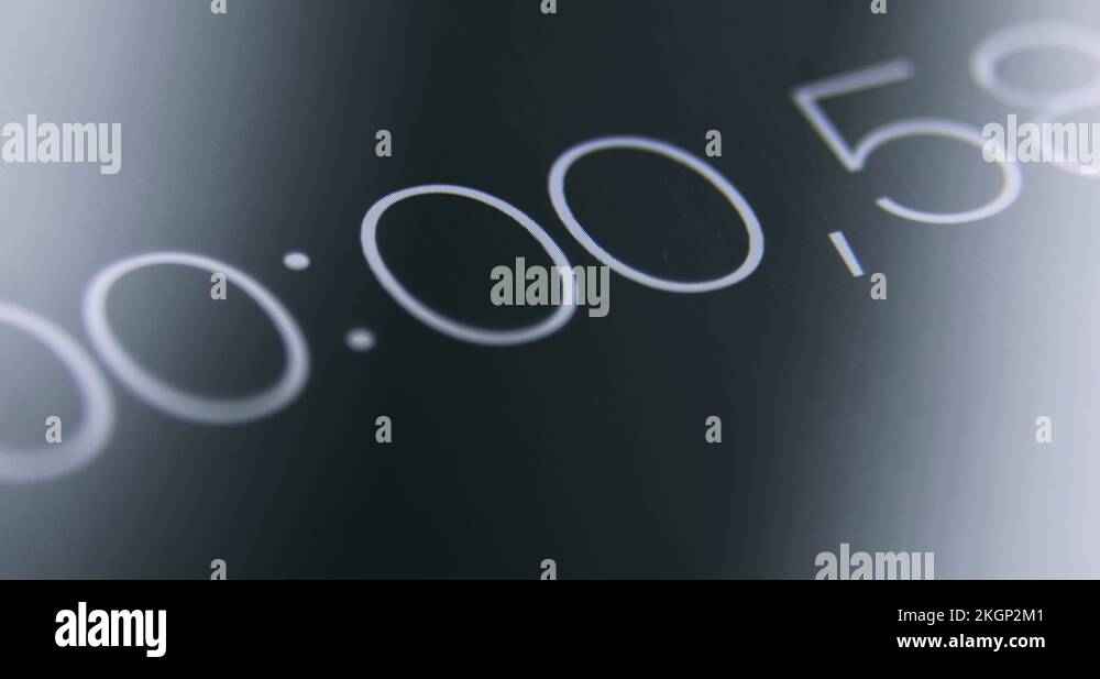 Black screen of digital stopwatch with white running numbers Stock