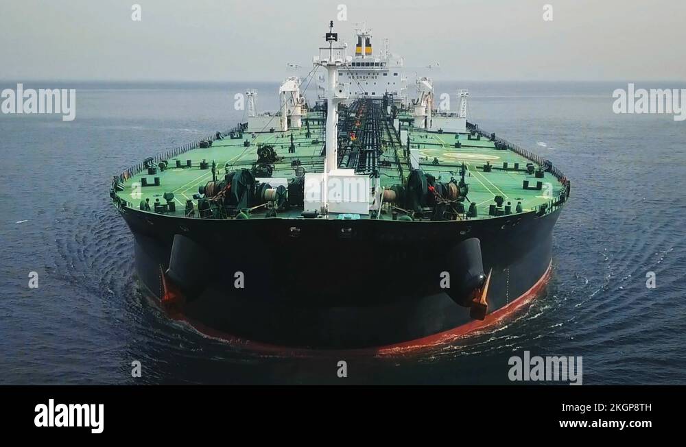 Bow and front deck of a tanker ship underway in the ocean. Aerial Stock