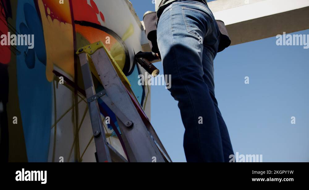 Graffiti artist painting with aerosol spray 4k Stock Video Footage - Alamy