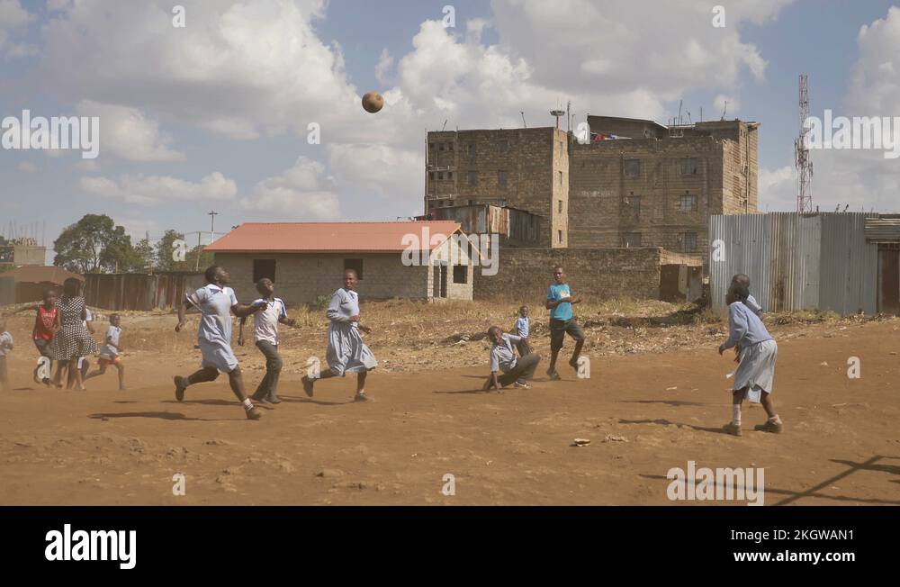 Kenyan school kids in uniform playing football playground, Kenya, Africa Stock Video Footage Alamy