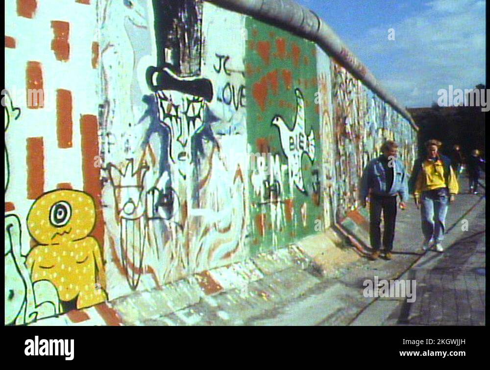 WEST BERLIN, WEST GERMANY, 1988, The Berlin Wall, people walk alongside