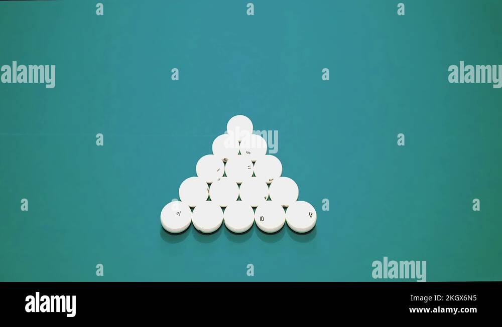 Russian billiards game. red ball breaks the pyramid of white balls, top