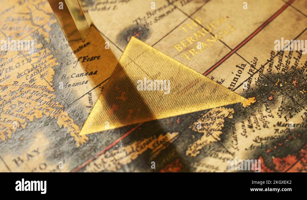 Bermuda triangle marked with golden ink on a vintage map. Compass