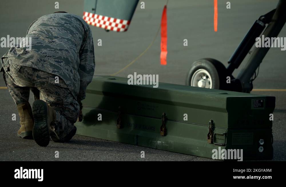 U.S. Air Force weapons specialist opening ammunition box for MQ-9 ...